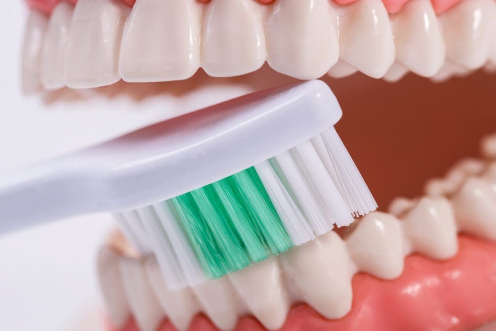 white teeth being brushed
